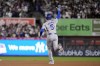 Los Angeles Dodgers' Freddie Freeman celebrates after hitting a two-run home run against the New York Yankees during the first inning in Game 4 of the baseball World Series, Tuesday, Oct. 29, 2024, in New York. (AP Photo/Godofredo A. Vásquez)