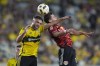 Columbus Crew defender Rudy Camacho, left, and New York Red Bulls forward Dante Vanzeir, right, head the ball in the first half of a first-round soccer match of the MLS Cup playoffs, Tuesday, Oct. 29, 2024, in Columbus, Ohio. (AP Photo/Sue Ogrocki)