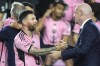 Inter Miami forward Lionel Messi, left, shakes hands with FIFA President Gianni Infantino, right, during a ceremony for the team winning the Supporters' Shield after an MLS soccer match against the New England Revolution, Saturday, Oct. 19, 2024, in Fort Lauderdale, Fla. (AP Photo/Lynne Sladky)