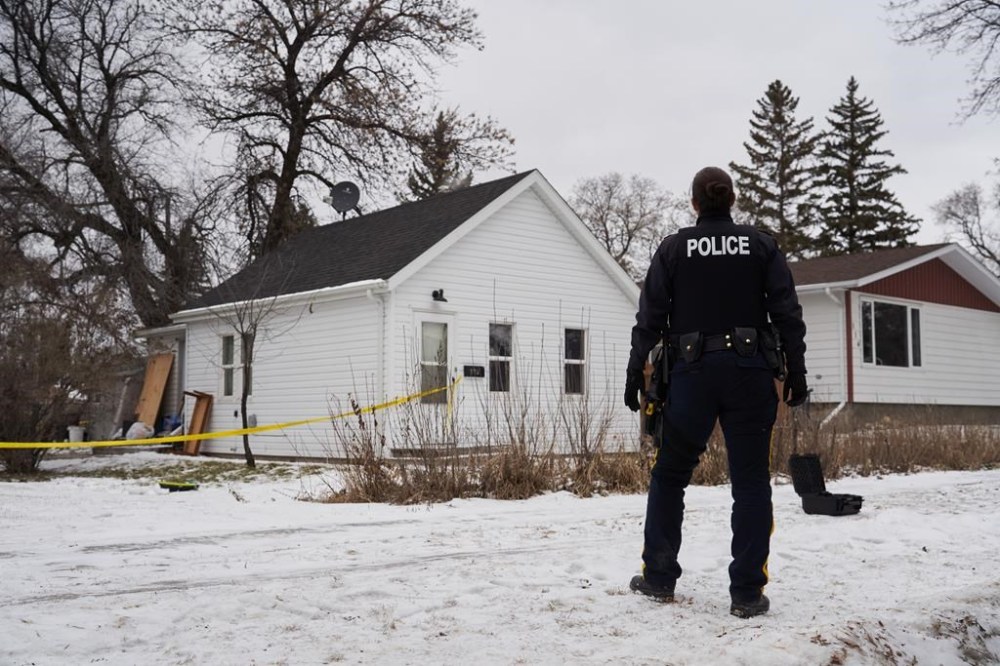 RCMP on the scene of an investigation into five deaths in southern Manitoba, in Carman, Man., Monday, Feb. 12, 2024. THE CANADIAN PRESS/David Lipnowski