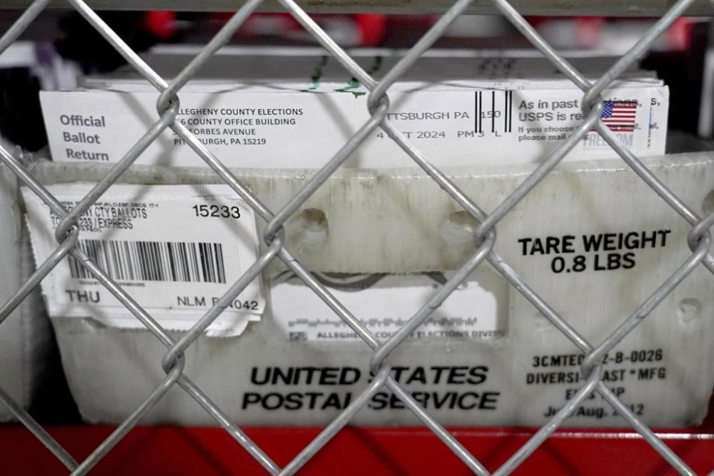 Mail-in ballots sit in a secure area of the Allegheny County Elections Division warehouse, Wednesday, Oct. 30, 2024, in Pittsburgh. (AP Photo/Matt Freed)