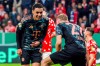 Bayern's Jamal Musiala, left, celebrates with Konrad Laimer after scoring a goal during a second round German Cup soccer match between FSV Mainz 05 and Bayern Munich, Wednesday, Oct. 30, 2024, in Mainz, Germany. (Torsten Silz/dpa via AP)