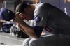 Los Angeles Dodgers pitcher Jack Flaherty sits in the dugout after being taken out of the game in the second inning against the New York Yankees in Game 5 of the baseball World Series, Wednesday, Oct. 30, 2024, in New York. (AP Photo/Ashley Landis)