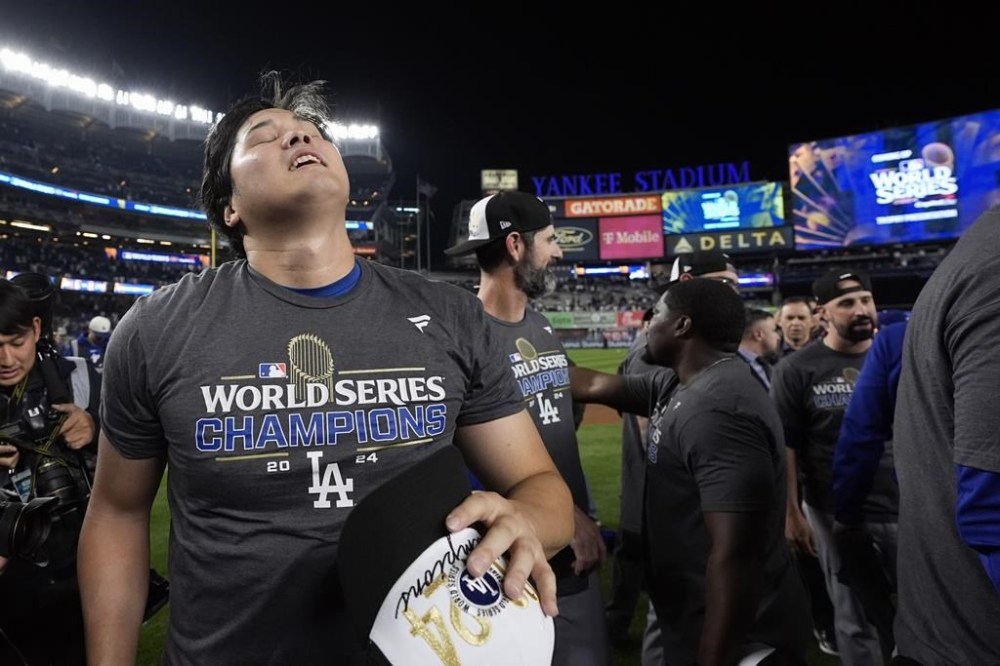 Los Angeles Dodgers' Shohei Ohtani celebrates after the Dodgers beat the New York Yankees in Game 5 to win the baseball World Series, Wednesday, Oct. 30, 2024, in New York. (AP Photo/Godofredo A. Vásquez)