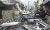 In this photo released by Hualien County Fire Department, a blown roof destroyed by the wind of Typhoon Kong-rey, lay across a road in Hualien County, eastern Taiwan, Thursday, Oct. 31, 2024. (Hualien County Fire Department via AP)