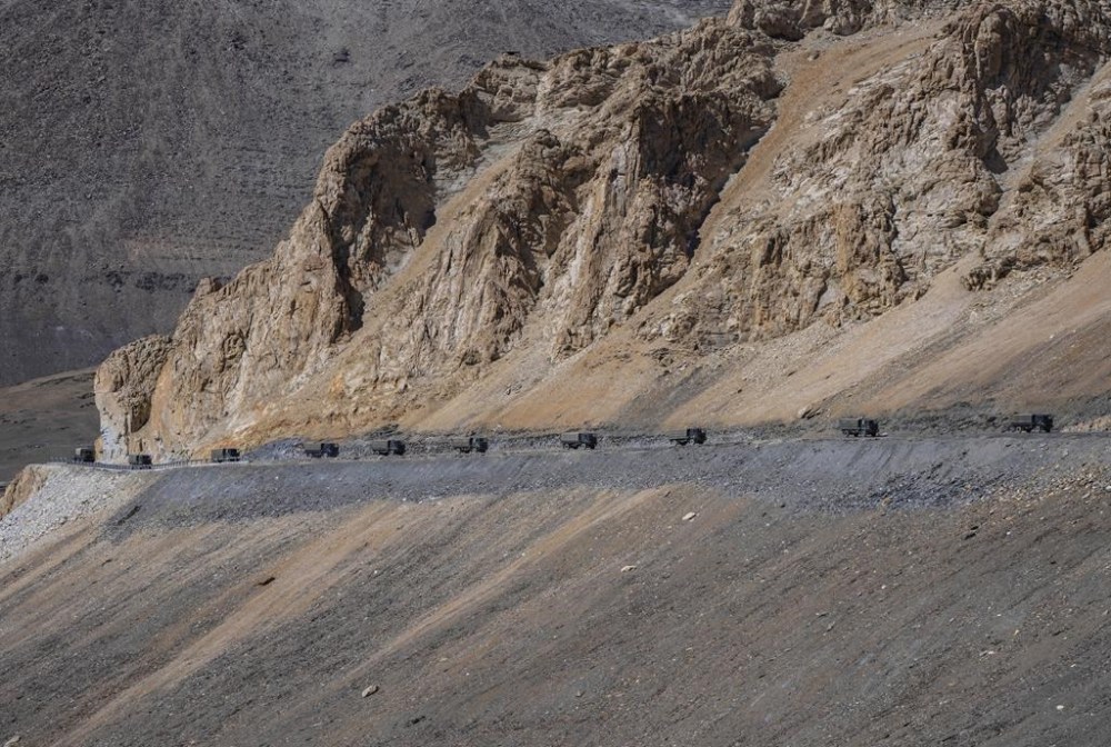 FILE- Indian army vehicles move in a convoy in the cold desert region of Ladakh, India, Sept. 18, 2022. (AP Photo/Mukhtar Khan, File)