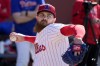 FILE - Philadelphia Phillies pitcher Dylan Covey throws during a baseball spring training workout Wednesday, Feb. 14, 2024, in Clearwater, Fla. (AP Photo/Charlie Neibergall, File)