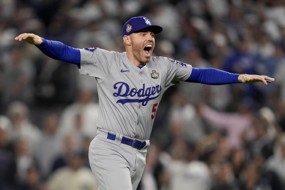 Los Angeles Dodgers first baseman Freddie Freeman celebrates their win against the New York Yankees in Game 5 to win the baseball World Series, Wednesday, Oct. 30, 2024, in New York. (AP Photo/Ashley Landis)