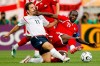 FILE - England's Joe Cole, left and Trinidad & Tobago's Dwight Yorke fight for the ball during the first half of their World Cup Group B soccer match in Nuremberg, Germany, June 15, 2006. (AP Photo/Kevork Djansezian, File)