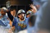 FILE - Milwaukee Brewers' Rhys Hoskins is congratulated in the dugout after hitting a grand slam during the first inning of a baseball game against the New York Mets, Sept. 27, 2024, in Milwaukee. (AP Photo/Aaron Gash, File)
