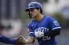 FILE - Kansas City Royals' Adam Frazier reacts at first base after his single drove in two runs during the ninth inning of a baseball game against the Washington Nationals, Thursday, Sept. 26, 2024, in Washington. (AP Photo/Nick Wass, File)