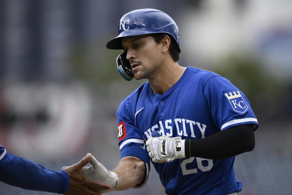 FILE - Kansas City Royals' Adam Frazier reacts at first base after his single drove in two runs during the ninth inning of a baseball game against the Washington Nationals, Thursday, Sept. 26, 2024, in Washington. (AP Photo/Nick Wass, File)