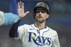 FILE - Tampa Bay Rays' Brandon Lowe celebrates after scoring on an RBI double by Junior Caminero off Minnesota Twins starting pitcher Simeon Woods Richardson during the third inning of a baseball game, Sept. 2, 2024, in St. Petersburg, Fla. (AP Photo/Chris O'Meara)