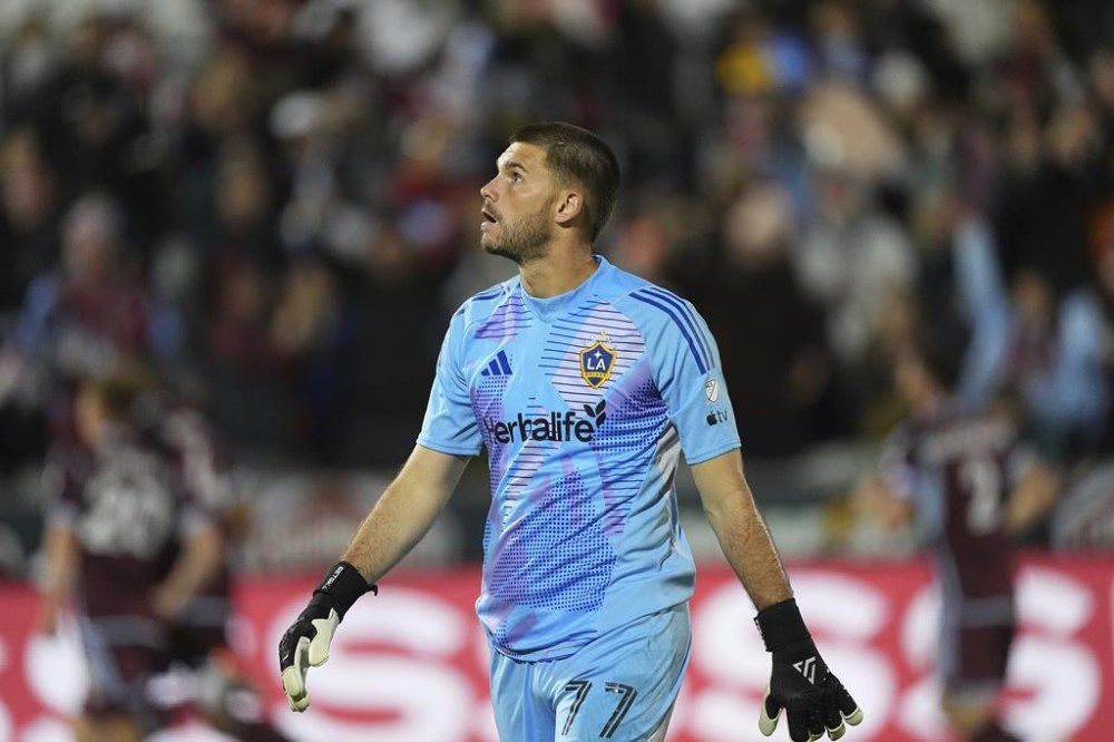 Los Angeles Galaxy goalkeeper John McCarthy looks at the video board after giving up a goal to Colorado Rapids midfielder Oliver Larraz in the first half of the second match of an MLS Cup opening-round playoff series Friday, Nov. 1, 2024, in Commerce City, Colo. (AP Photo/David Zalubowski)