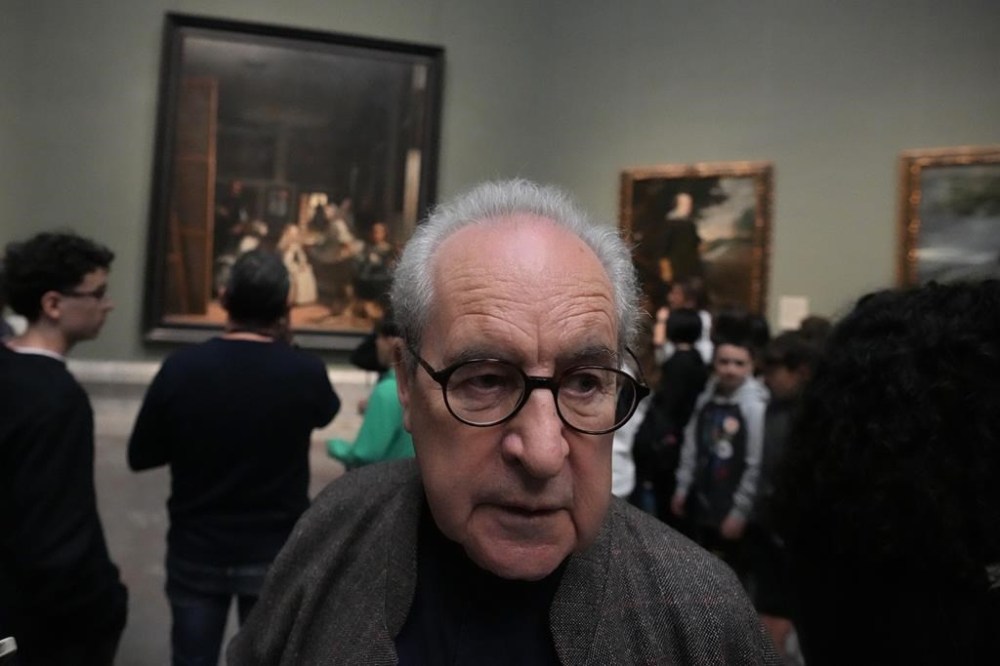 Novelist John Banville walks around looking at paintings including 'Diego Velazquez's 'Las Meninas' in the background at the Prado Museum in Madrid, Spain, Wednesday, Oct. 23, 2024. (AP Photo/Paul White)