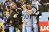 New York City FC's Santiago Rodriguez (10) embraces Justin Haak (80) after they defeated FC Cincinnati in Game 2 in the first round of the MLS Cup soccer playoffs, Saturday, Nov. 2, 2024, in New York. (AP Photo/Kena Betancur)