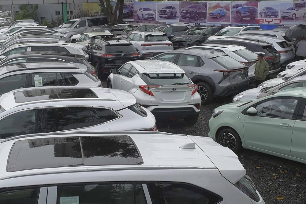 A batch of electrical vehicles for sale parked at a car yard in Addis Ababa, Ethiopia Thursday, Oct. 3, 2024. (AP Photo)