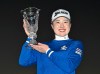 Rio Takeda of Japan holds up her trophy after winning the LPGA's Toto Japan Classic in a playoff at the Seta Golf Course in Otsu, western Japan, Sunday, Nov. 3, 2024. (Keiji Uesho/Kyodo News via AP)