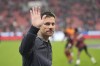 Leverkusen's head coach Xabi Alonso greets supporters ahead the German Bundesliga soccer match between Bayer Leverkusen and VfB Stuttgart at the BayArena in Leverkusen, Germany, Friday, Nov. 1, 2024. (AP Photo/Martin Meissner)