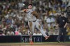 FILE - San Francisco Giants third baseman Matt Chapman throws to first for the out on San Diego Padres' Xander Bogaerts during the sixth inning of a baseball game, Sept. 6, 2024, in San Diego. (AP Photo/Gregory Bull, File)