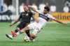 Los Angeles FC's Maxime Chanot, back left, and Vancouver Whitecaps' Brian White vie for the ball during the first half of a first-round MLS Cup playoffs soccer match, in Vancouver, on Sunday, Nov. 3, 2024. THE CANADIAN PRESS/Darryl Dyck