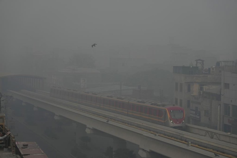 Orange Line Metro Train runs as heavy fog reduces visibility, in Lahore, Pakistan, Sunday, Nov. 3, 2024. (AP Photo/K.M. Chaudary)