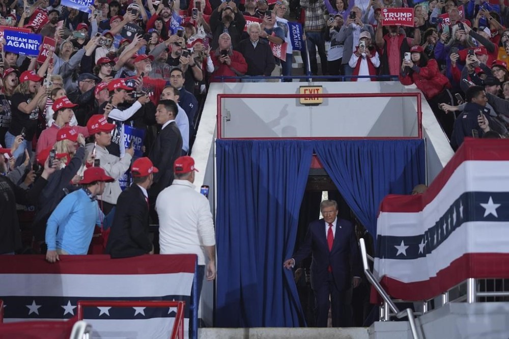 Republican presidential nominee former President Donald Trump arrives to speak at a campaign rally at J.S. Dorton Arena, Monday, Nov. 4, 2024, in Raleigh, N.C. (AP Photo/Evan Vucci)