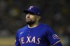 FILE - Texas Rangers' Nathan Eovaldi walks to the dugout after pitching against the Oakland Athletics during the sixth inning of a baseball game, Sept. 24, 2024, in Oakland, Calif. (AP Photo/Godofredo A. Vásquez, file)