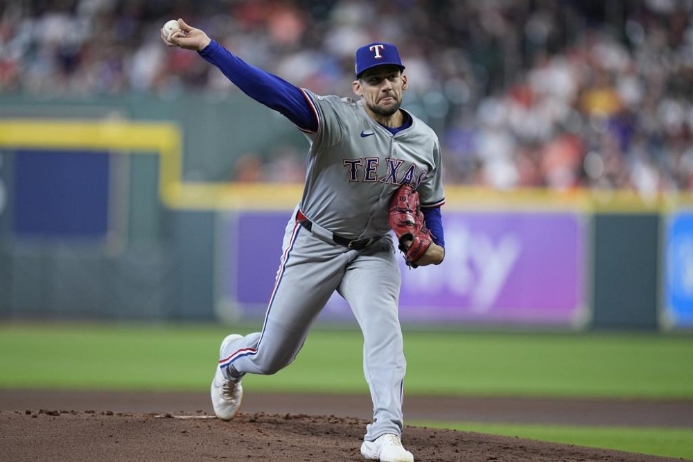 FILE - Texas Rangers starting pitcher Nathan Eovaldi delivers during the first inning of a baseball game against the Houston Astros, April 14, 2024, in Houston. (AP Photo/Kevin M. Cox, file)