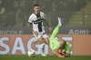 Parma's Dennis Man vies for the ball with Genoa's goalkeeper Nicola Leali during the Serie A match between Parma and Genoa at the Ennio Tardini Stadium in Parma, Italy, Monday Nov. 4, 2024. (Massimo Paolone/LaPresse via AP)