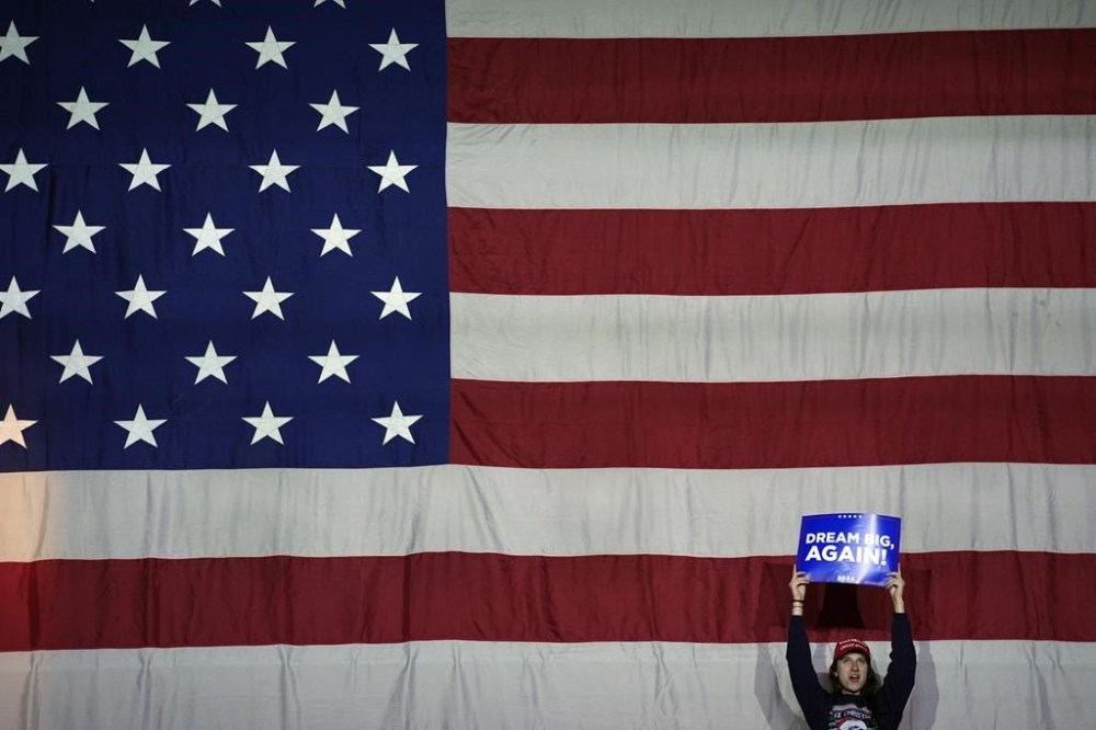 A supporter arrives before Republican presidential nominee former President Donald Trump speaks at a campaign rally at Santander Arena, Monday, Nov. 4, 2024, in Reading, Pa. (AP Photo/Evan Vucci)