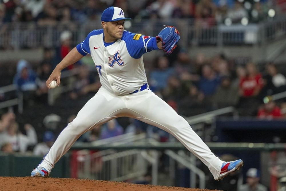 FILE - Atlanta Braves pitcher Joe Jiménez throws in the eighth inning of a baseball game against the Kansas City Royals, Sept. 28, 2024, in Atlanta. (AP Photo/Jason Allen, File)