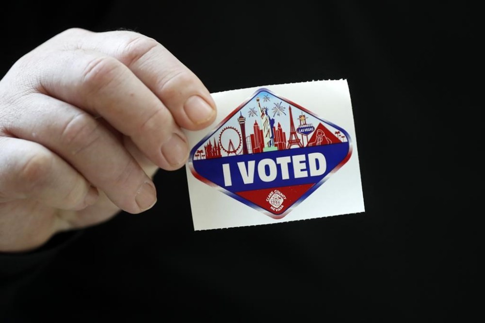 A voter displays an