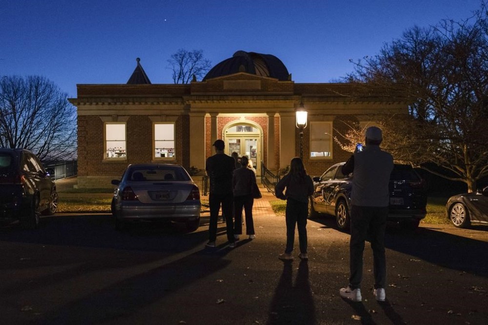 Voters line up to enter their polling place at the Cincinnati Observatory on election day, Tuesday, Nov. 5, 2024, in Cincinnati. (AP Photo/Carolyn Kaster)