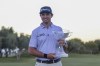 J.T. Poston poses with the trophy after winning the Shriners Children's Open golf tournament, Sunday, Oct. 20, 2024, in Las Vegas. (AP Photo/Ian Maule)