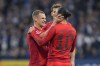 Joshua Kimmich, left, celebrates Leroy Sane, right, after he scored the 4th goal during the German Bundesliga soccer match between VfL Bochum and Bayern Munich in Bochum, Germany, Sunday, Oct. 27, 2024. (AP Photo/Martin Meissner)