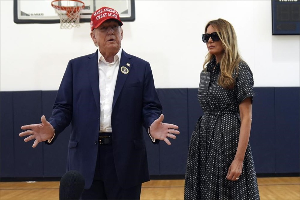 Republican presidential nominee former President Donald Trump speaks as former first lady Melania Trump listens after they voted on Election Day at the Morton and Barbara Mandel Recreation Center, Tuesday, Nov. 5, 2024, in Palm Beach, Fla. (AP Photo/Evan Vucci)