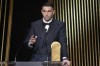 Argentinian goalkeeper Emiliano Martinez receives the Yashin Trophy during the 68th Ballon d'Or (Golden Ball) award ceremony at Theatre du Chatelet in Paris, Monday, Oct. 28, 2024. (AP Photo/Michel Euler)