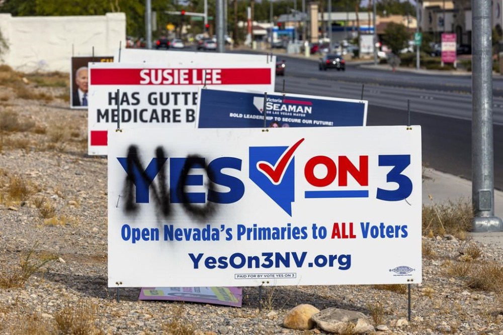 A vandalized election sign is seen along Buffalo Drive on Election Day in Las Vegas, Tuesday, Nov. 5, 2024. (L.E. Baskow/Las Vegas Review-Journal via AP)