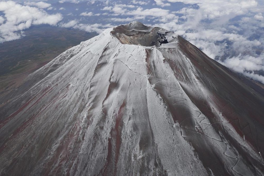 Mt. Fuji in Japan is covered with snow Wednesday, Nov. 6, 2024. (Kyodo News via AP)