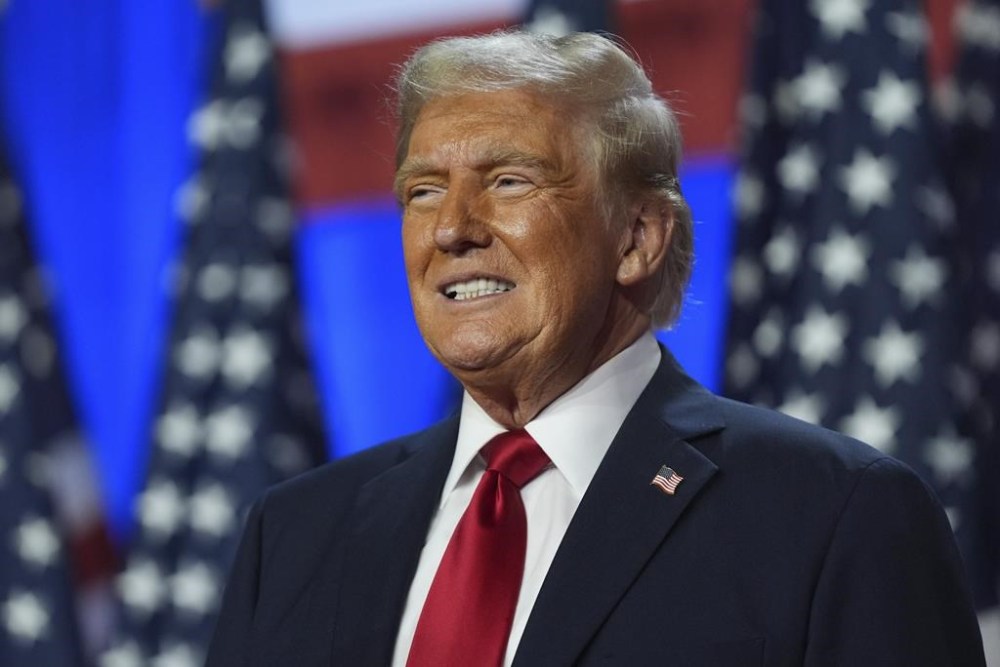 Republican presidential nominee former president Donald Trump smiles at an election night watch party at the Palm Beach Convention Center, Wednesday, Nov. 6, 2024, in West Palm Beach, Fla. Prime Minister Justin Trudeau extended congratulations to Trump on his re-election as president of the United States.THE CANADIAN PRESS/AP/Evan Vucci