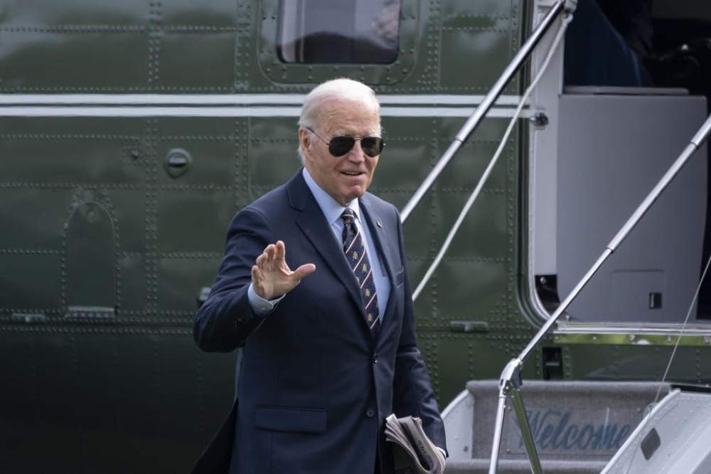 President Joe Biden walks from Marine One as he arrives on the South Lawn of the White House in Washington, Monday, Nov. 4, 2024. (AP Photo/Ben Curtis)