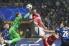 Inter Milan's goalkeeper Yann Sommer, top left, makes a safe on Arsenal's Mikel Merino during a Champions League opening phase soccer match between Inter Milan and Arsenal at the San Siro stadium in Milan, Italy, Wednesday, Nov. 6, 2024. (AP Photo/Luca Bruno)