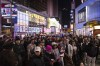People watch an ABC News livestream showing poll results in Times Square in New York, Wednesday, Nov. 6, 2024. (AP Photo/Yuki Iwamura)