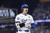 Los Angeles Dodgers' Shohei Ohtani reacts after advancing to third on a fielding error by New York Yankees second baseman Gleyber Torres during the eighth inning in Game 1 of the baseball World Series, Friday, Oct. 25, 2024, in Los Angeles. (AP Photo/Godofredo A. Vásquez)