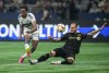 Vancouver Whitecaps' Ali Ahmed, left, takes a shot on goal past Los Angeles FC's Maxime Chanot during the second half of a first-round MLS Cup playoffs soccer match, in Vancouver, on Sunday, November 3, 2024. The Vancouver Whitecaps are one win away from moving on to the next round of the Major League Soccer playoffs. THE CANADIAN PRESS/Darryl Dyck