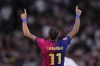 Barcelona's Raphinha celebrates after scoring his side's fourth goal during a Spanish La Liga soccer match between Real Madrid and Barcelona at the Santiago Bernabeu stadium in Madrid, Spain, Saturday, Oct. 26, 2024. (AP Photo/Manu Fernandez)