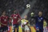 Lille's goalkeeper Lucas Chevalier, right, saves the ball nest to Juventus' Federico Gatti second right during the Champions League opening phase soccer match between Lille and Juventus at the Stade Pierre Mauroy in Villeneuve-d'Ascq, outside Lille, France, Tuesday, Nov. 5, 2024. (AP Photo/Christophe Ena)