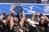 Los Angeles Dodgers pitcher Clayton Kershaw hold the World Series trophy during the baseball team's World Series championship parade and celebration at Dodger Stadium, Friday, Nov. 1, 2024, in Los Angeles. (AP Photo/Mark J. Terrill)