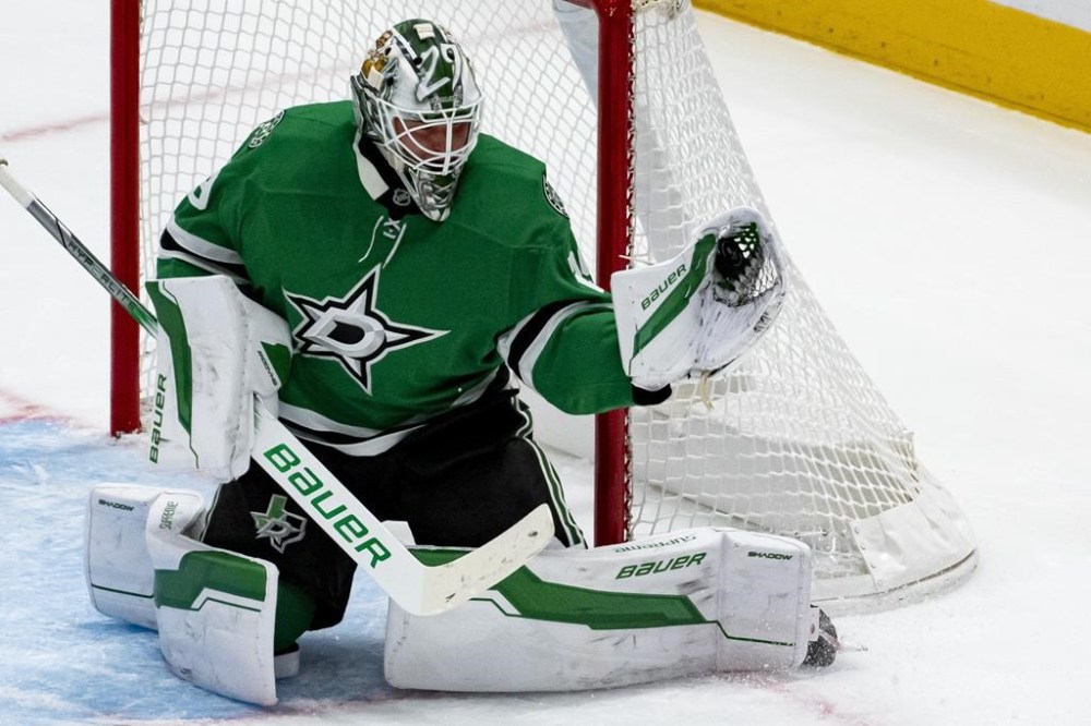 Dallas Stars goaltender Jake Oettinger (29) makes a save during the first period of an NHL hockey game against the Chicago Blackhawks, Saturday, Oct. 26, 2024, in Dallas. (AP Photo/Emil T. Lippe)